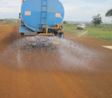 Pre-wetting the surface prior to compaction